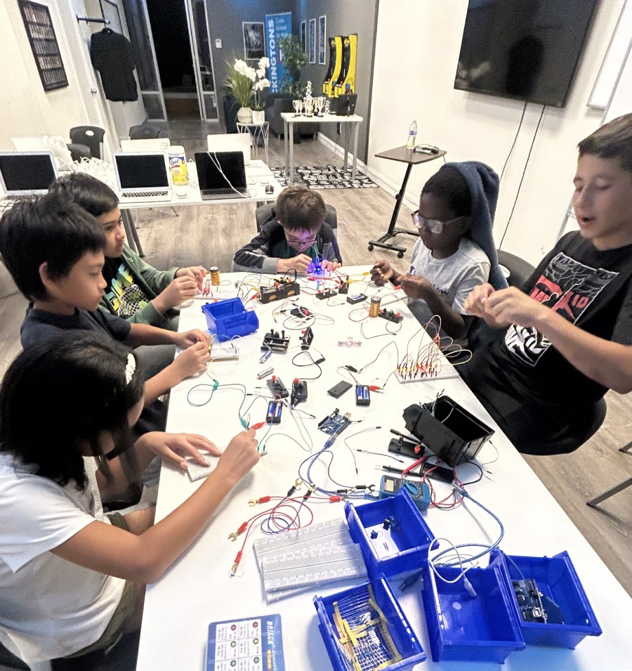 Kids working together on electronics and robotics at Hackingtons